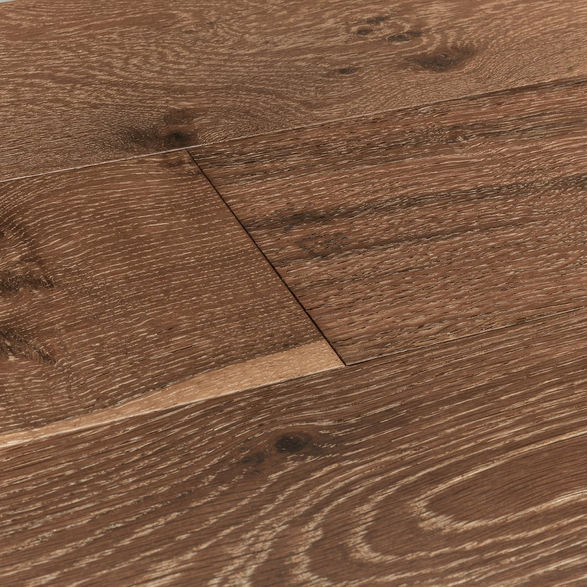 Dark brown hardwood floor planks of lynton evening oak with natural wood grain pattern and visible knots