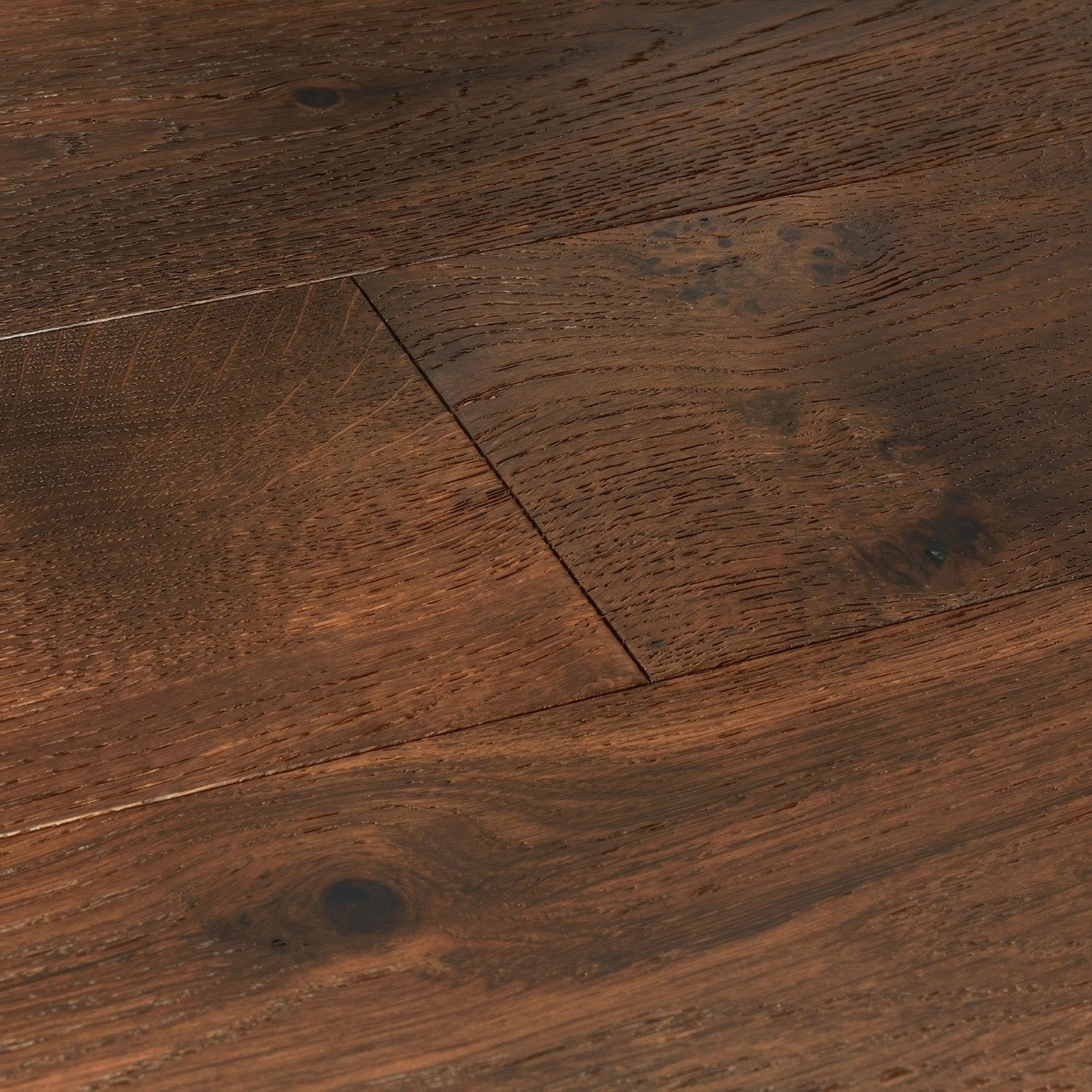Dark brown Lynton Weald oak hardwood floor planks with rustic natural wood grain and visible knots