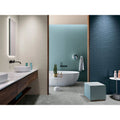 Lyon 1836 Marengo Matt grey marble-effect tiles with a freestanding bathtub