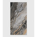 A sleek rectangular magnifique porcelain nero bookmatched tile with gray black and subtle gold marble veining