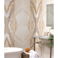Beige and cream marble-effect porcelain wall tiles with flowing golden veining magnifique oro bookmatched design