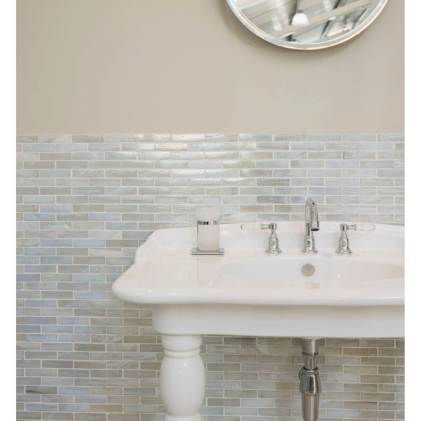 Malacassa Oasis Brick Glass Mosaic beige and grey brick glass mosaic with a white pedestal sink and soap dispenser