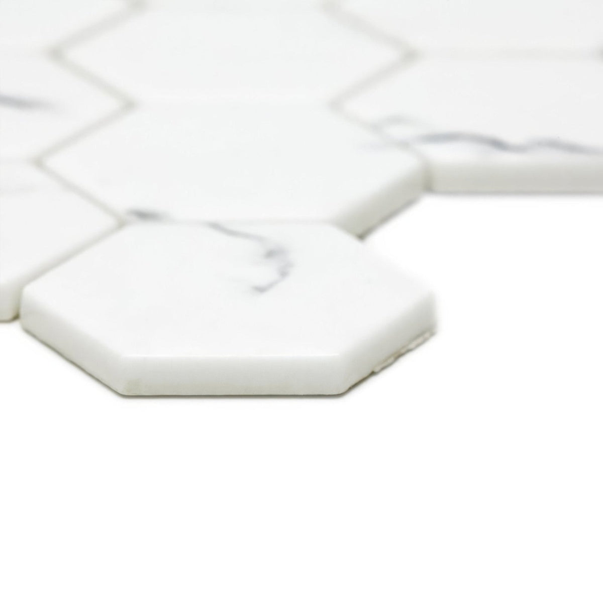 Malmo Hexagon white mosaic tiles made of hexagonal marble with subtle gray veining for elegant wall or floor use