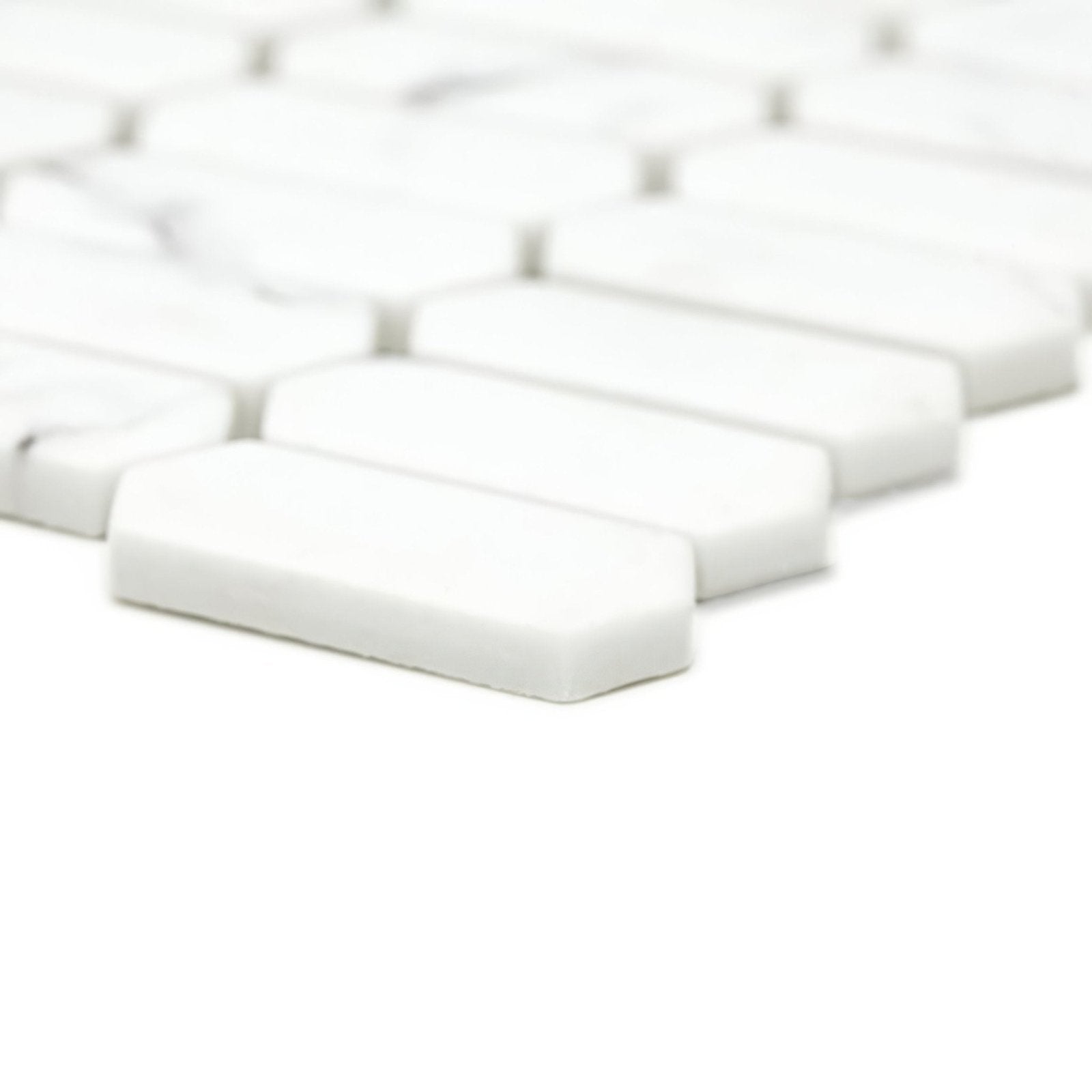 White rectangular mosaic tiles with rounded edges in a staggered pattern from malmo picket white mosaic collection