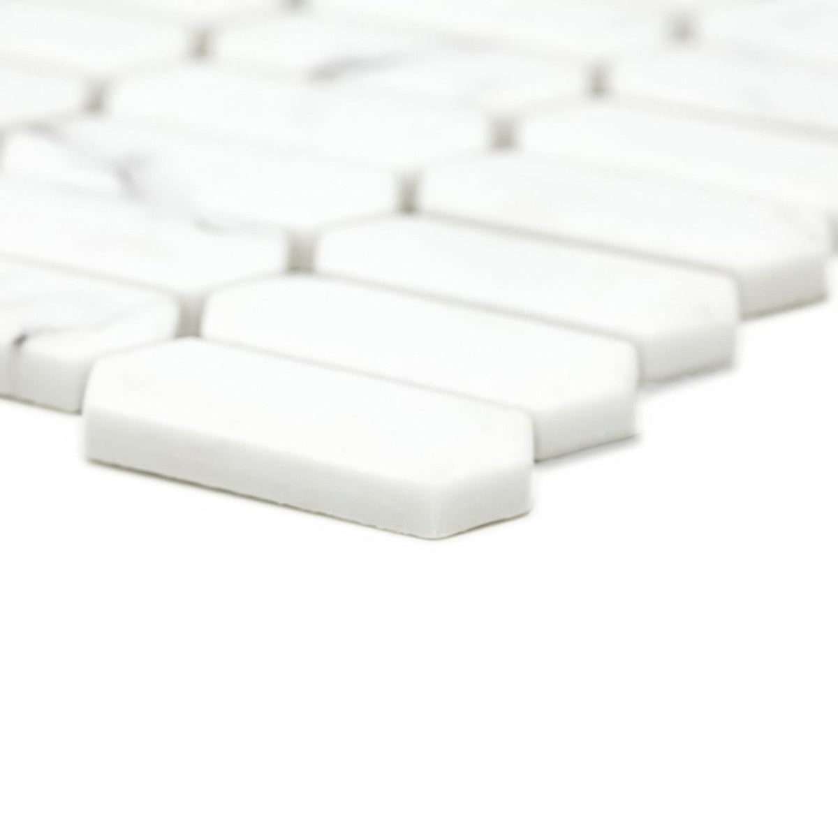 White rectangular mosaic tiles with rounded edges in a staggered pattern from malmo picket white mosaic collection