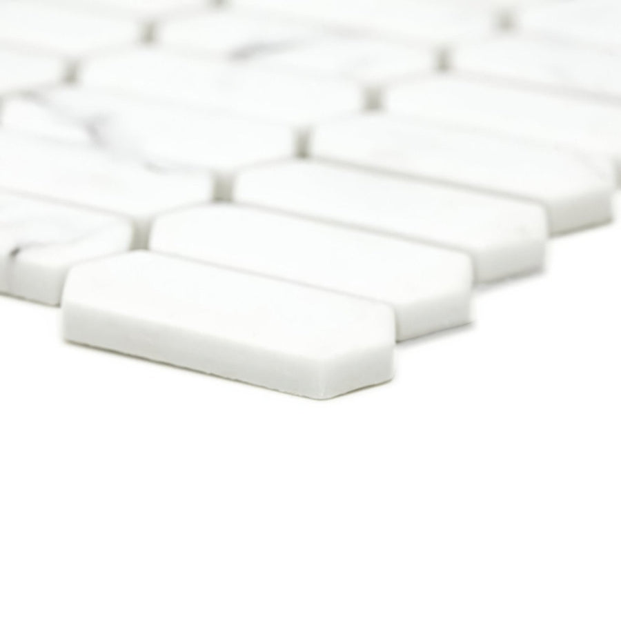 White rectangular mosaic tiles with rounded edges in a staggered pattern from malmo picket white mosaic collection