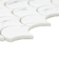 White marble mosaic tiles with a scalloped fish scale design from the malmo scallop white mosaic collection