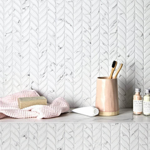 Malmo Willow Leaf White Mosaic white marble mosaic with a blush pink toothbrush holder