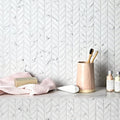 Malmo Willow Leaf White Mosaic white marble mosaic with a blush pink toothbrush holder