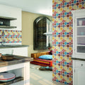 Mandala 28 x 28cm patterned mosaic tile with circular designs in teal, coral, mustard and cream