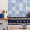 Deep blue enamel stove manoir deco with polished chrome knobs and stainless steel front panel for stylish cooking