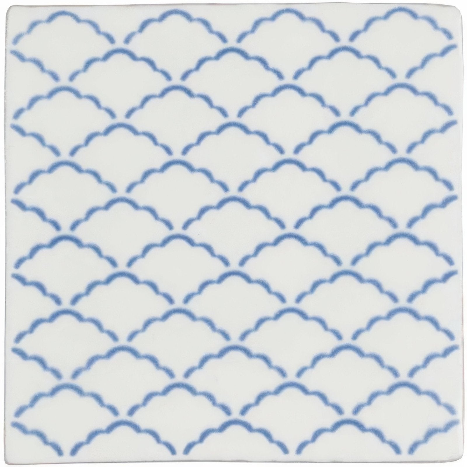 White ceramic tile manoir nuage on papyrus with a repeating pattern of blue scalloped waves