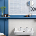 White ceramic wall-mounted Manoir Nuage sink with chrome faucets on Papyrus for modern bathroom use