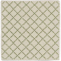 Cream-colored ceramic Manoir Trellis pumice coaster with subtle olive green diamond dot pattern for table protection