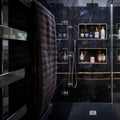 Marble Ocean Rock dark blue marble-effect tiles with a dark grey towel