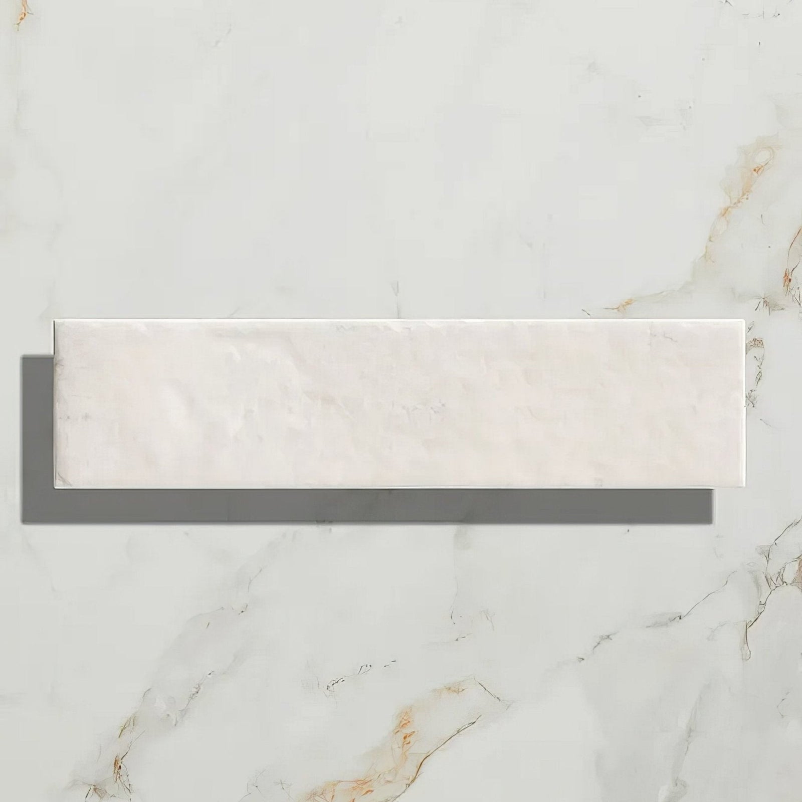 A sleek rectangular white marble porcelain parquet tile with subtle golden veining in cotton white gloss finish