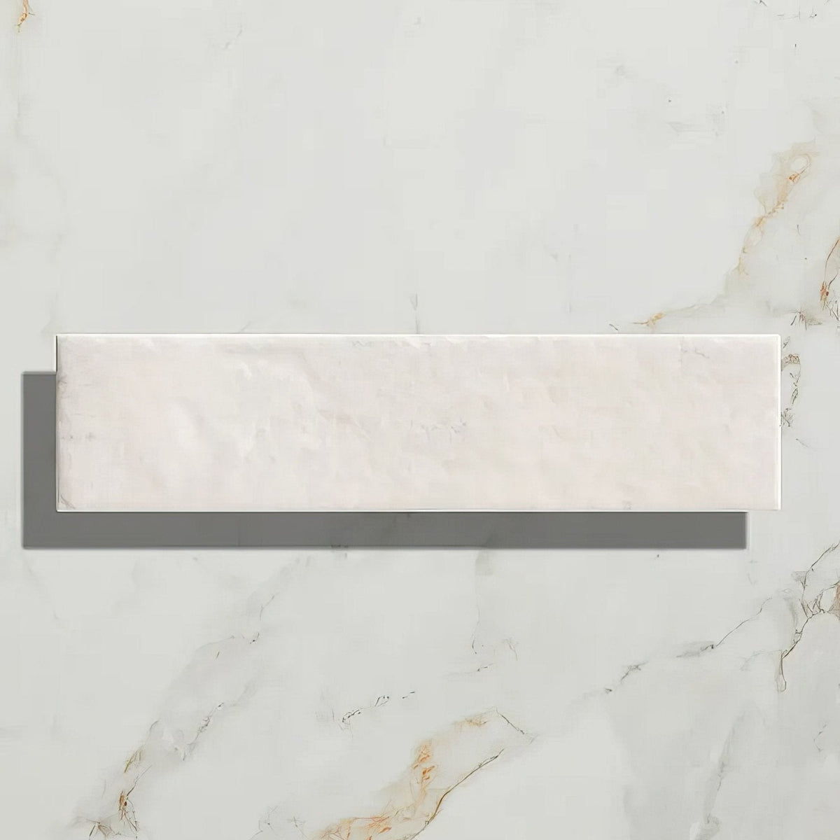 A sleek rectangular white marble porcelain parquet tile with subtle golden veining in cotton white gloss finish