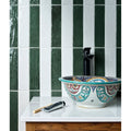 A marlborough porcelain parquet forest green gloss ceramic vessel sink with colorful floral and geometric patterns