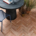 Terracotta brick patio with herringbone pattern featuring marlborough porcelain parquet natural tiles