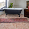 Black clawfoot Marlborough porcelain parquet natural bathtub with white interior and chrome fixtures