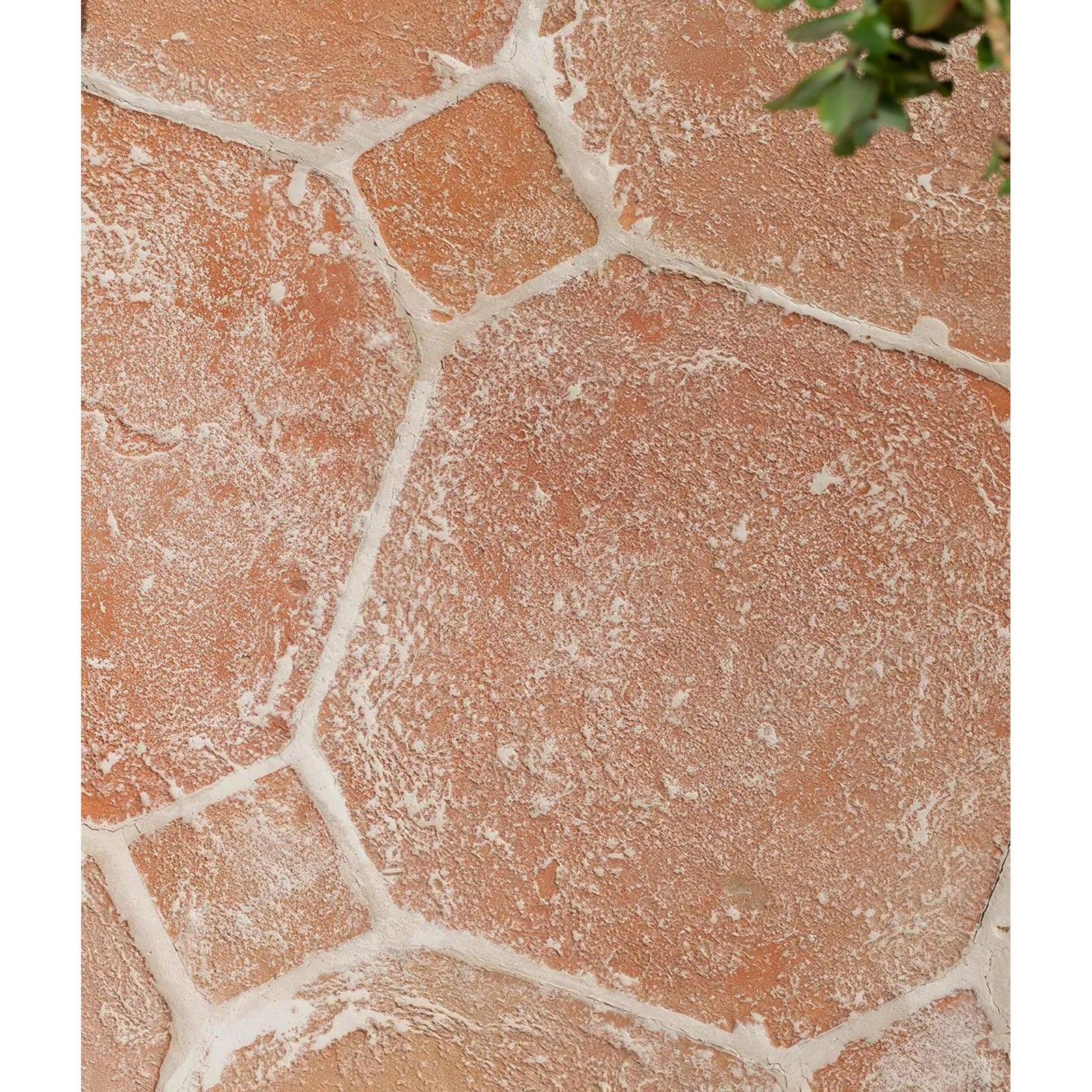 Marlborough terracotta octagons and cabochons featuring irregular terracotta stone tiles with rough texture and white mortar joints