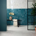 Teal glossy ceramic maroc ceramic bianco tiles with a white tile accent wall for stylish wall design