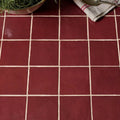 Red square ceramic tiles with white grout lines from maroc ceramic bordeaux collection for wall and floor use