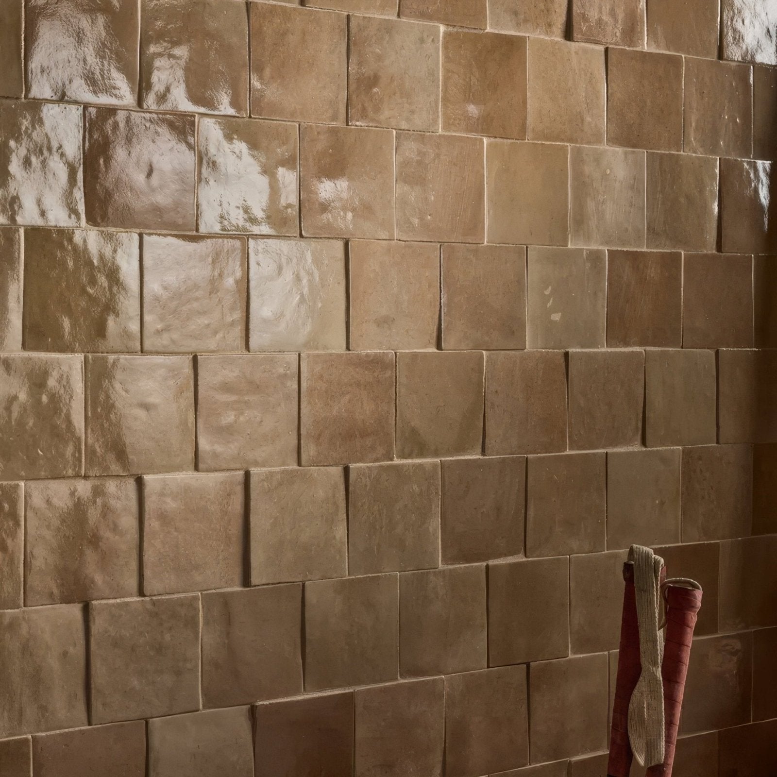 Tan glossy ceramic tiles with subtle texture from maroc ceramic caramel collection for stylish interior use