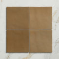 Maroc ceramic caramel four square earthy brown ceramic tiles arranged in a grid for flooring or walls