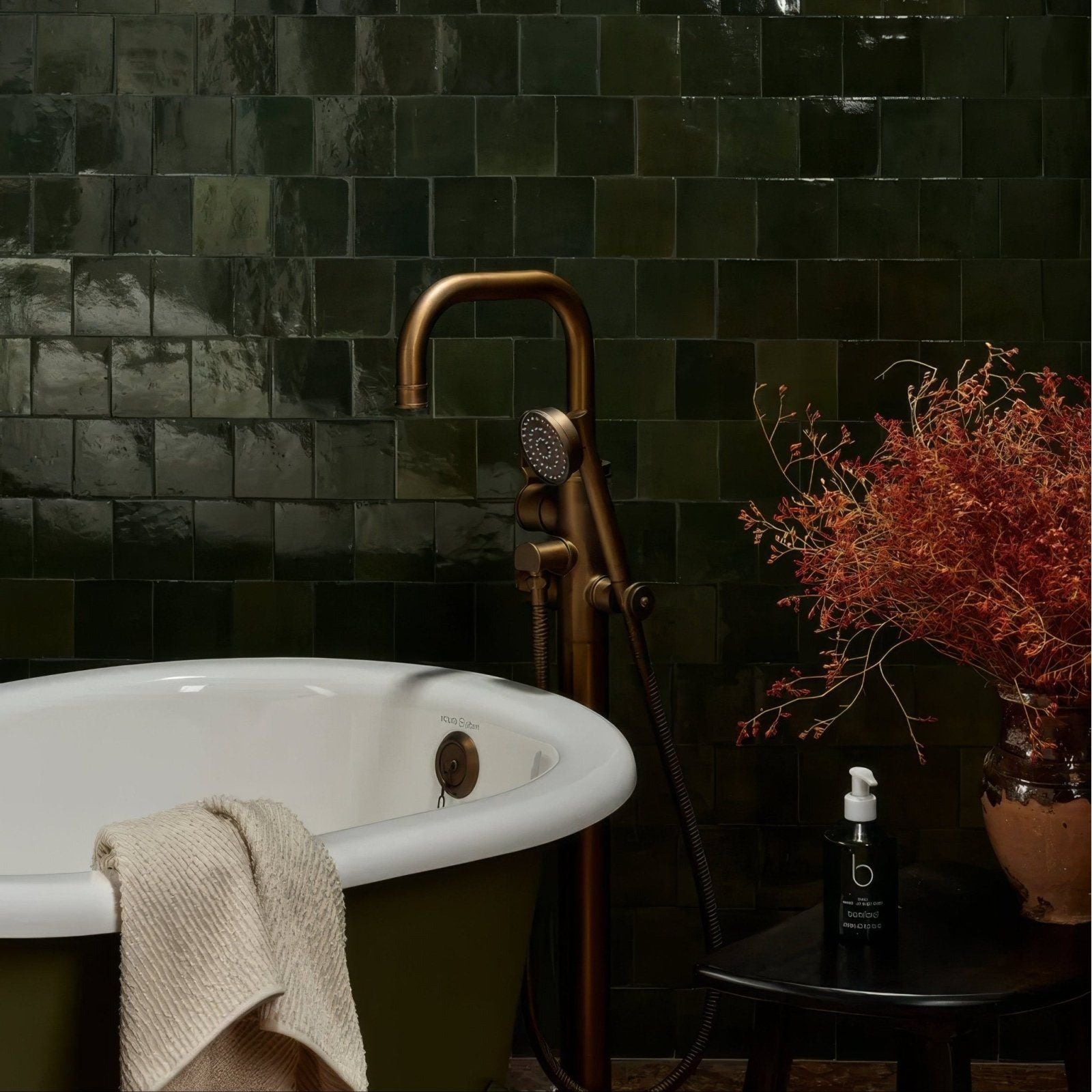 Antique brass bathtub faucet with curved spout and handheld showerhead from maroc ceramic forest collection