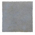 A square textured maroc ceramic glicine stone tile in muted grayish blue with subtle natural tone variations