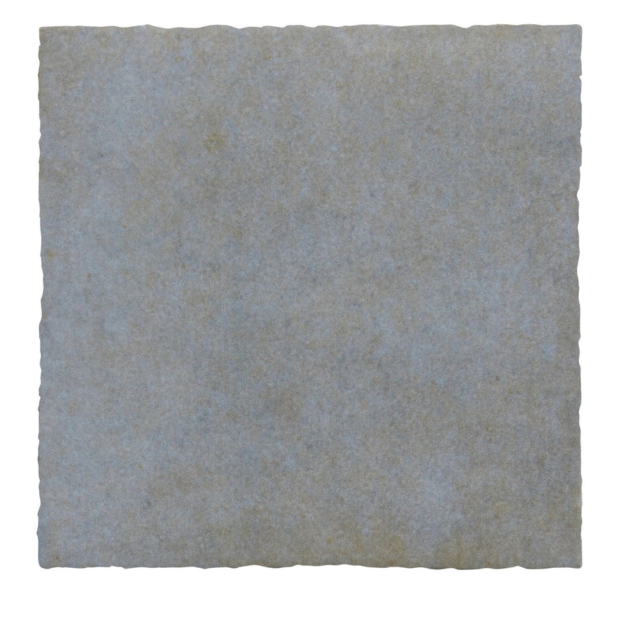 A square textured maroc ceramic glicine stone tile in muted grayish blue with subtle natural tone variations