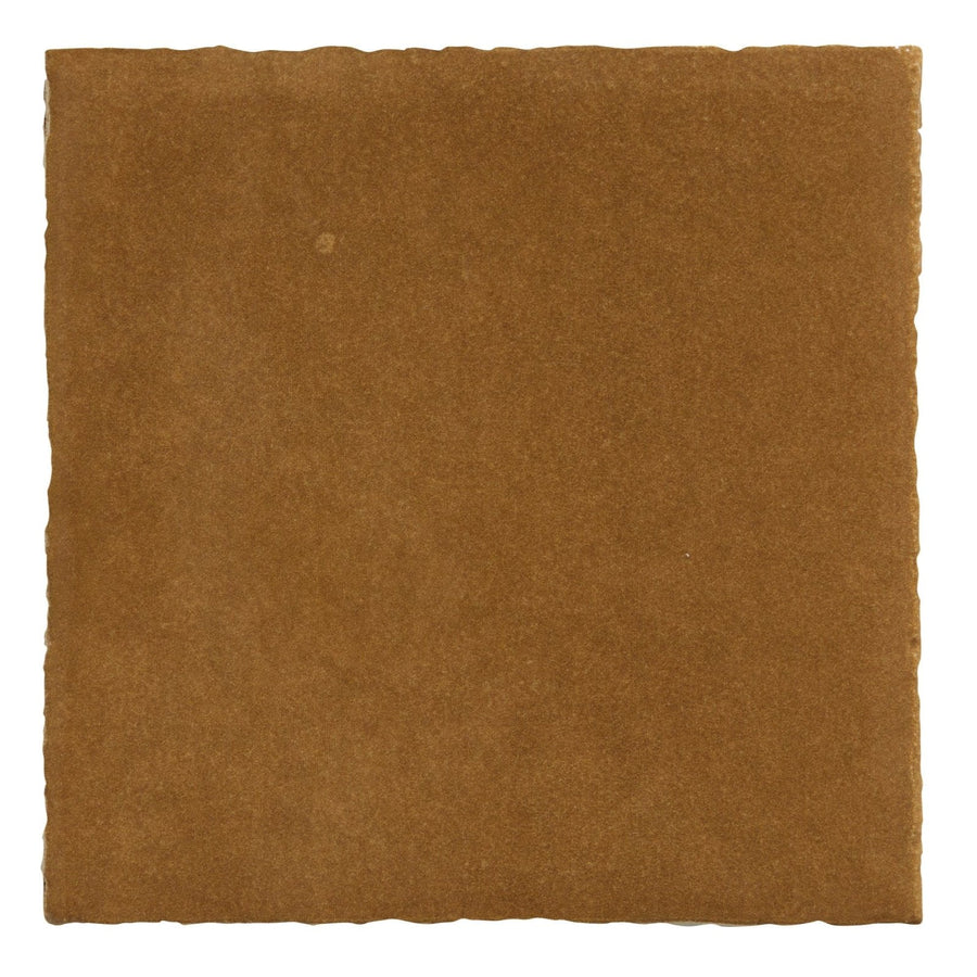 A square earthy brown ceramic tile with rough texture and irregular edges from maroc ceramic khaki collection