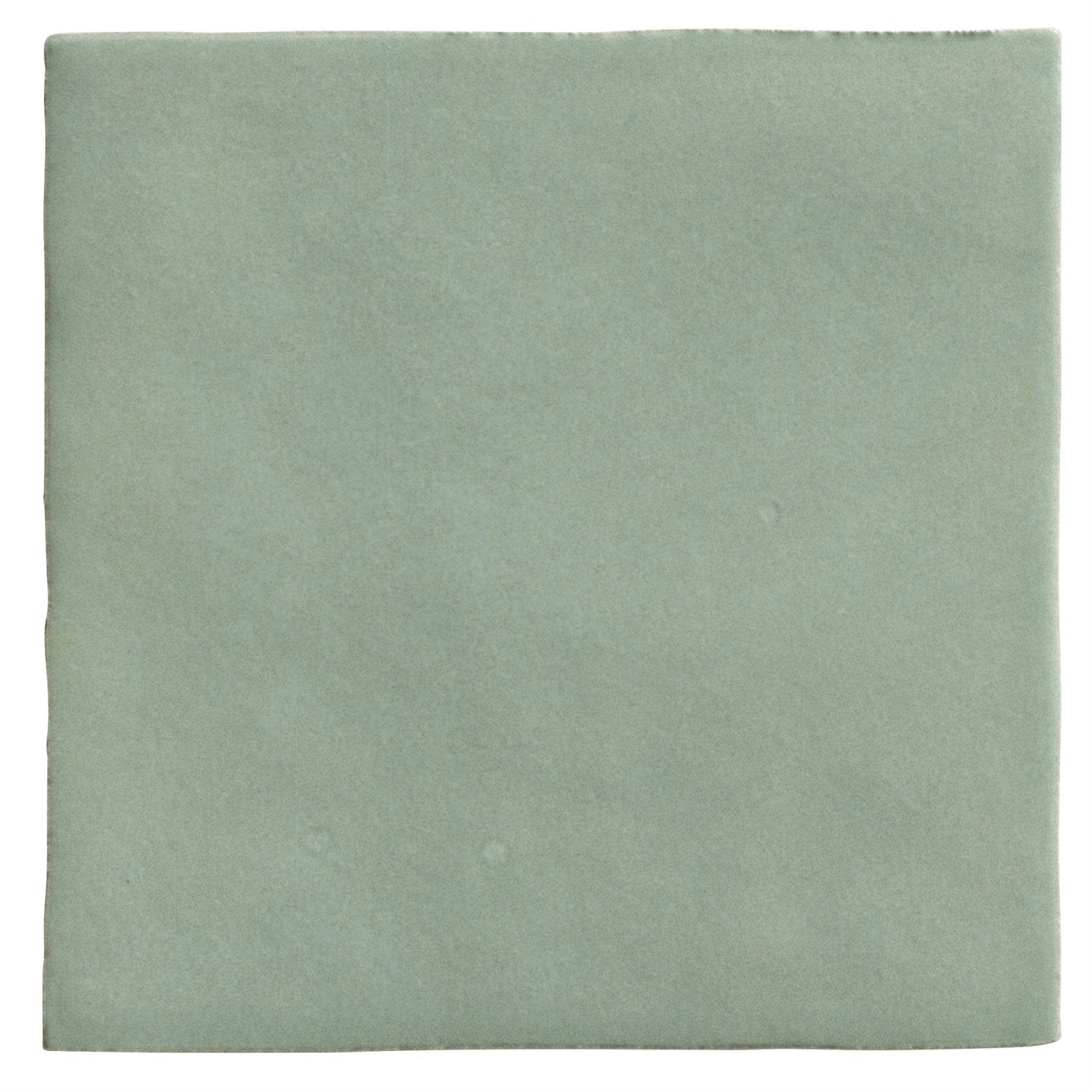 A square matte-finished ceramic tile in soft sage green from Maroc Ceramic Mint collection