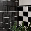 Maroc ceramic nero black and white glossy ceramic tiles arranged in a checkerboard pattern with thin white grout lines