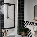 Maroc Ceramic Nero black and white ceramic tiles on a shower wall in a checkerboard pattern