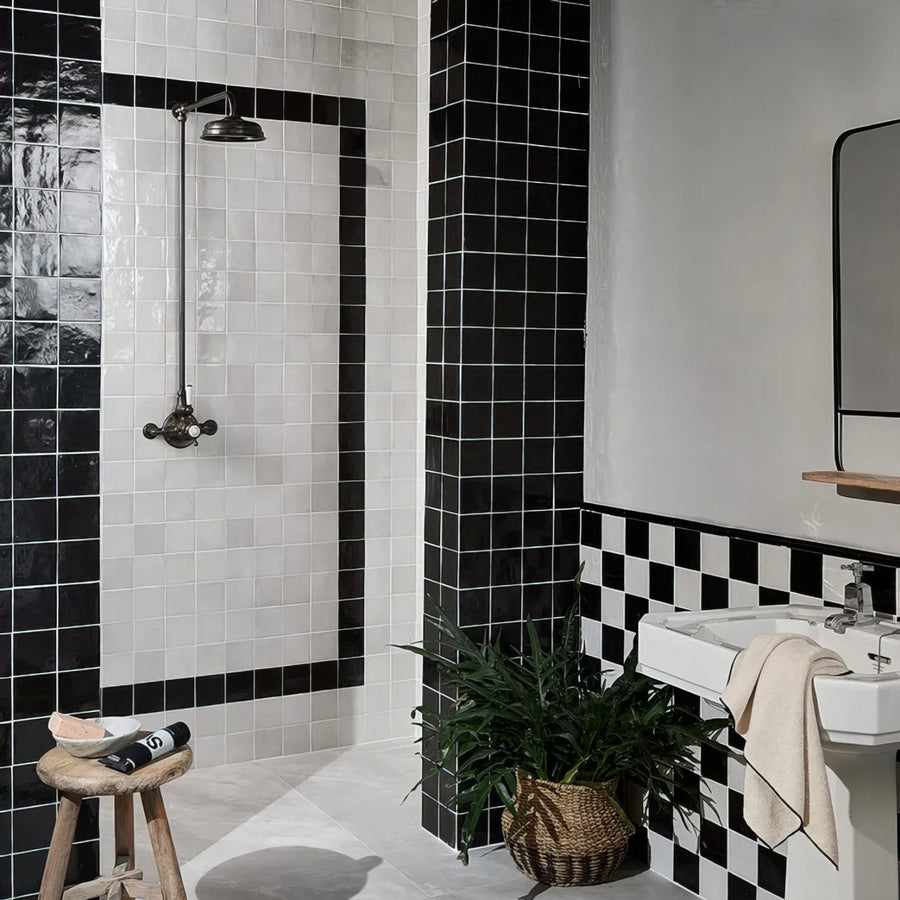Maroc Ceramic Nero black and white ceramic tiles on a shower wall in a checkerboard pattern