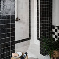 Maroc ceramic nero black and white tiled shower wall with brass faucet featuring ceramic material and elegant design
