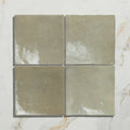 Maroc ceramic sage four matte sage green ceramic tiles arranged on a marble surface for home decor