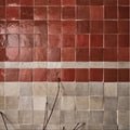 Maroc ceramic tomato red and gray terracotta tiles with glossy finish arranged in a grid pattern