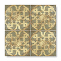 Four square terracotta tiles with distressed vintage geometric pattern in muted gold and gray from marrakech asni collection