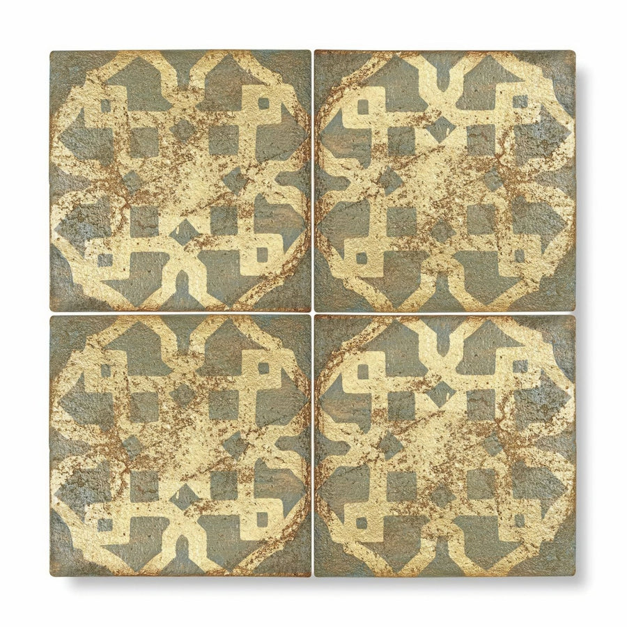 Four square terracotta tiles with distressed vintage geometric pattern in muted gold and gray from marrakech asni collection