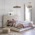 A white tiled bed frame with matching platform base featuring square ceramic tiles in a grid pattern from Marrakech Cream Terracotta Base Tile 11.8cm