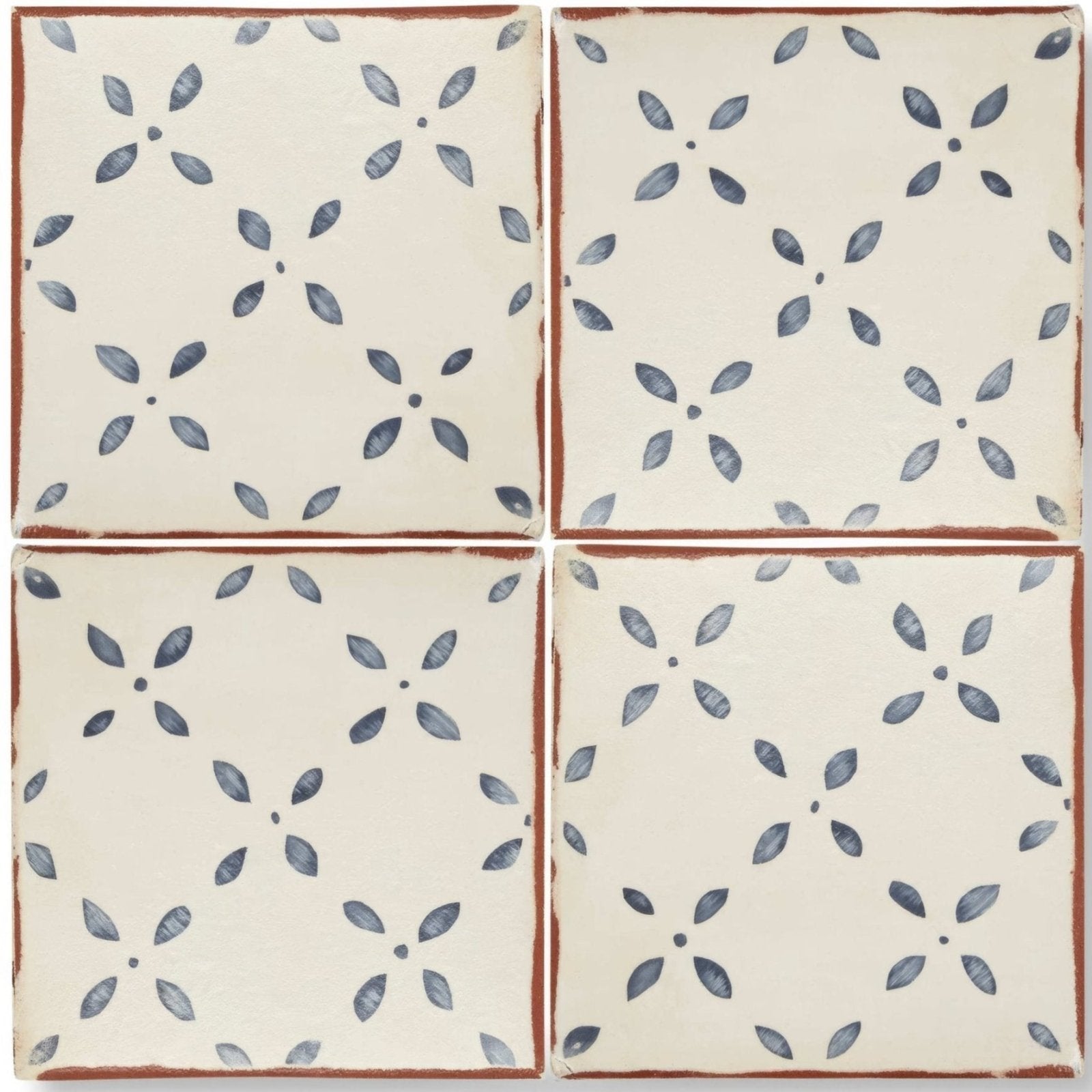 Cream-colored ceramic Marrakech El Hara patterned terracotta tile with blue floral pattern and rustic brown edges