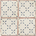 Cream-colored ceramic Marrakech El Hara patterned terracotta tile with blue floral pattern and rustic brown edges
