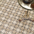 Black and white ornate patterned terracotta floor tiles with vintage distressed finish from the Marrakech hammam collection