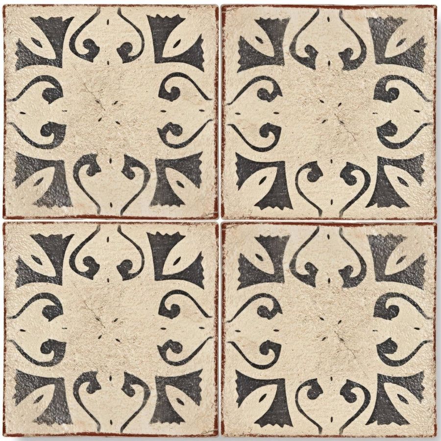 Four square beige terracotta tiles with black ornate hammam patterns and rustic edges from marrakech collection