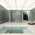 Marvel Diva Aqua Polished green marble-effect tiles in a minimalist shower with black fixtures