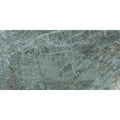 A polished marvel diva galaxy marble slab in light teal green with subtle gray and faint reddish brown veining