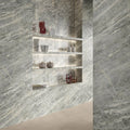 Marvel Diva Sky Stone Velvet grey marble-effect tiles with built-in shelves and decorative vases